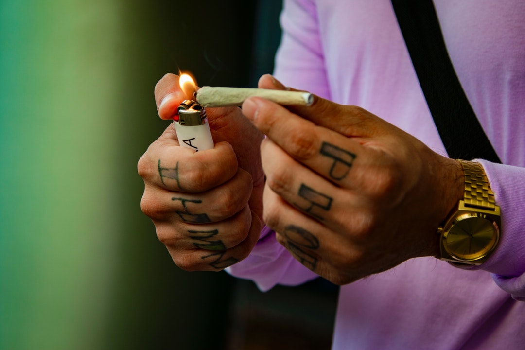 Cannabis Pre-roll or joint being lit and ready to smoke from a dispensary near me